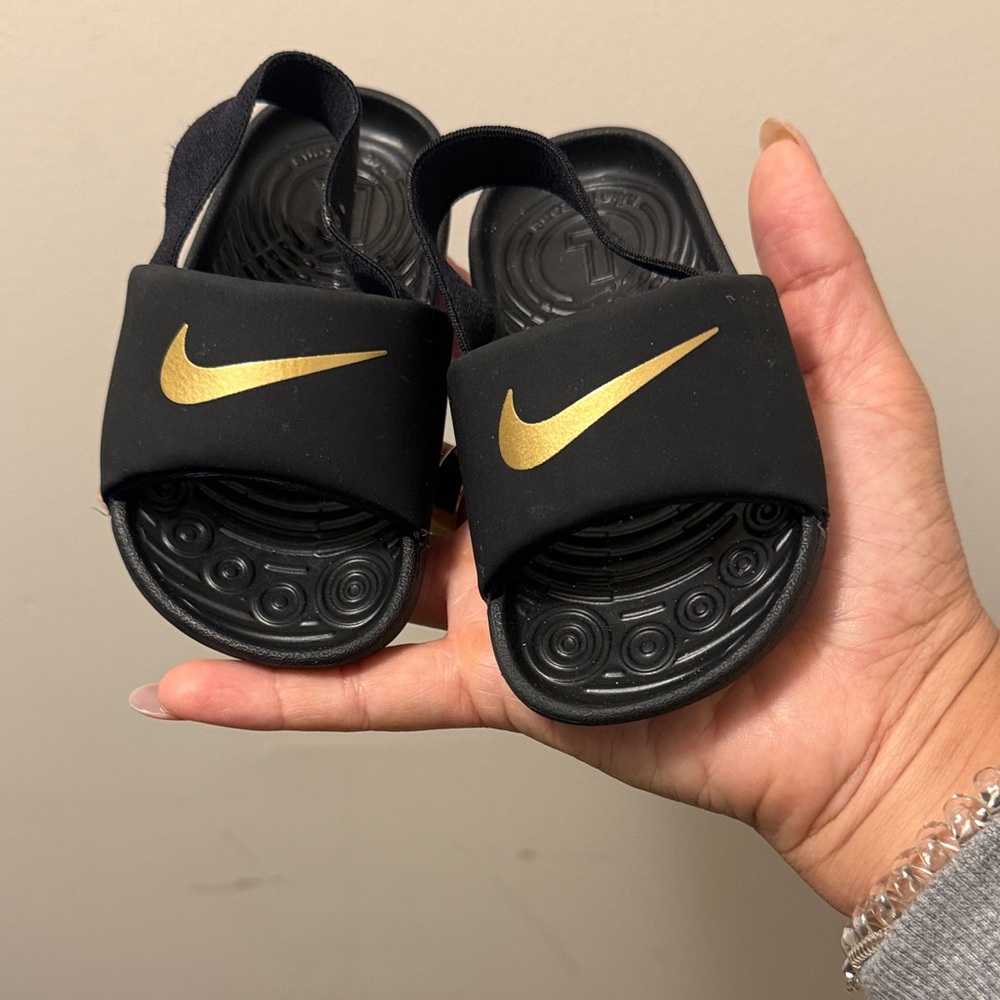 Nike Kids Black and Gold Slide Sandals